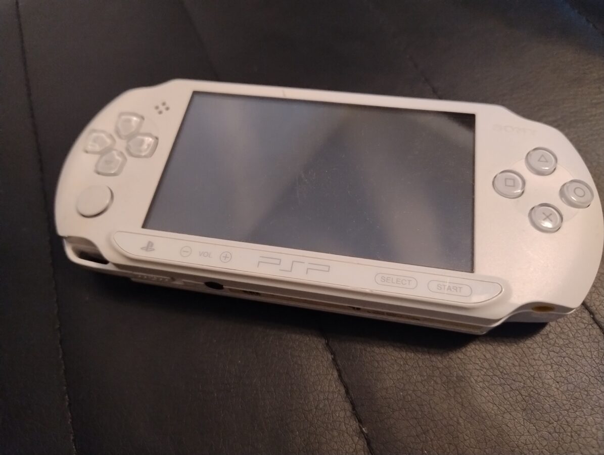 white PSP handheld gaming console